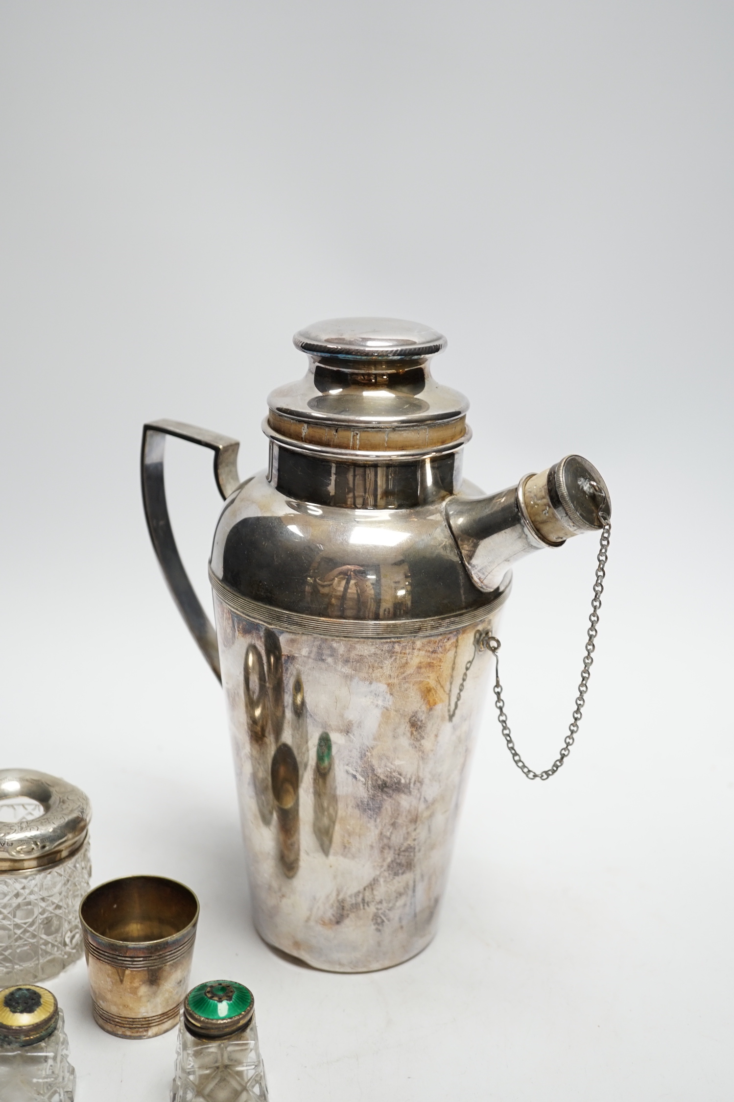 A plated cocktail shaker and sundry small silverwares including silver salt with Bristol blue glass liner, largest 23cm high